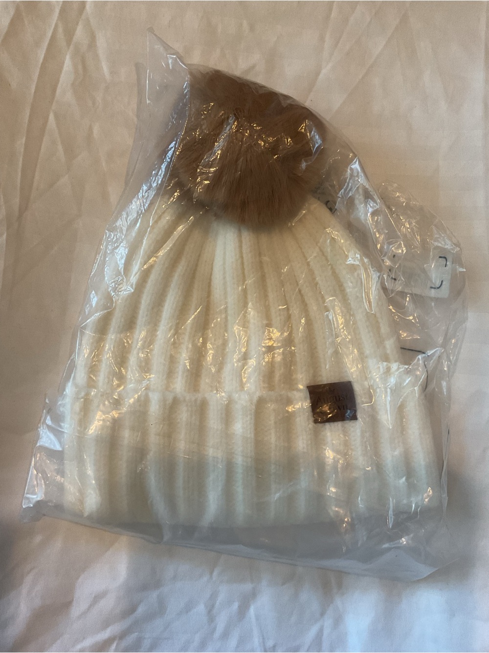 Neutral Cream Ribbed Knit Beanie with Tan Faux Fur Pom